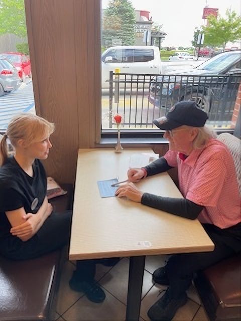Tim going over some procedures with an employee